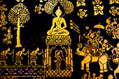 Wat Xieng Thong temple in Luang Prabang, Laos. Detail of the  intricate gold stencilling on black lacquer that decorate the walls of the sim. Detail of the 'battle of Mara' from Buddhist Jataka